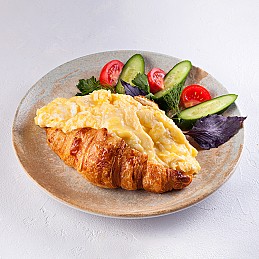 Croissant with omelette and cheese